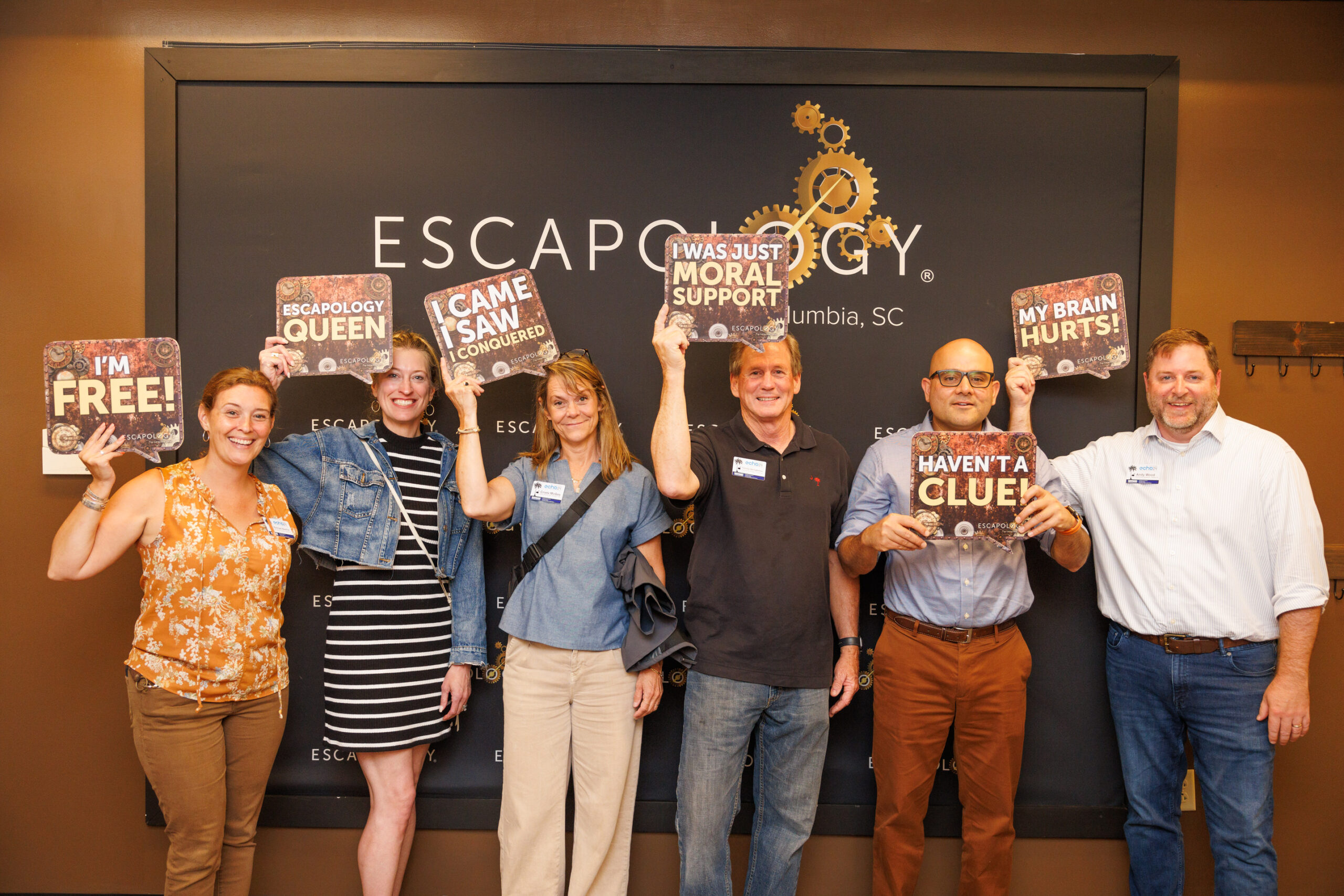 Echo 24 attendees celebrating after succeeding at an escape room event